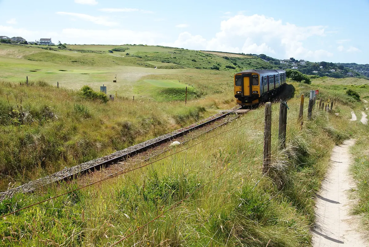 A St Ives branch line train running beside the coast path